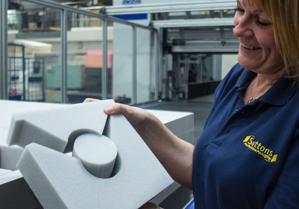 A person holding a polyurethane foam pack