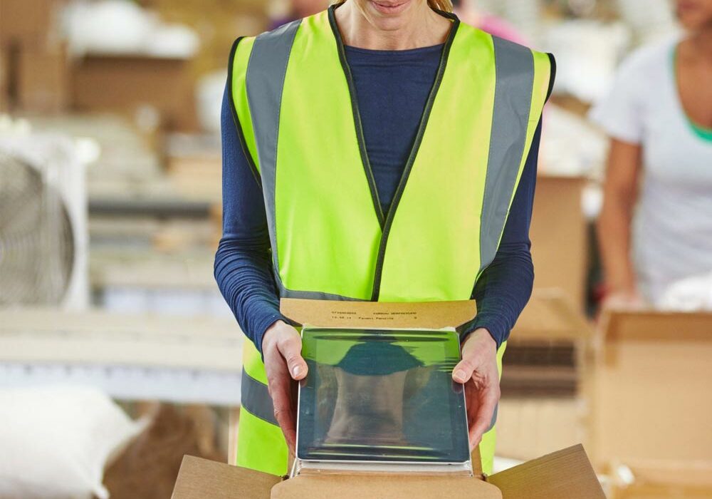 A person assembling Sealed Air packaging in a factory