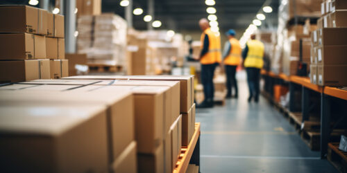 Cardboard boxes in a warehouse undertaking inventory management