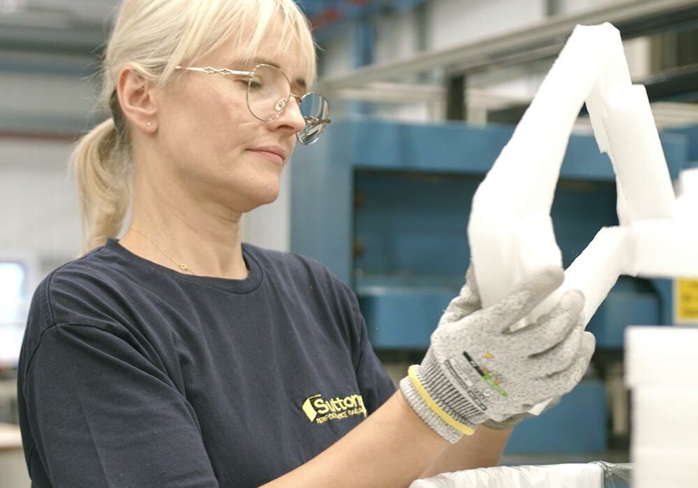 Sustainability A person making recycled foam packaging at Suttons Performance Packaging