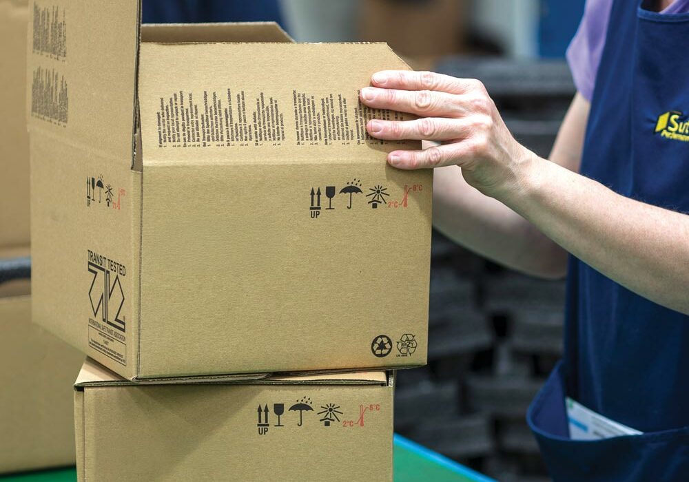 What we do A person making corrugated packaging